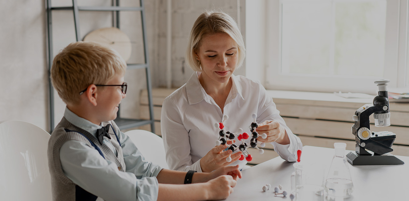 Female science tutor in Escondido studying chemistry with student