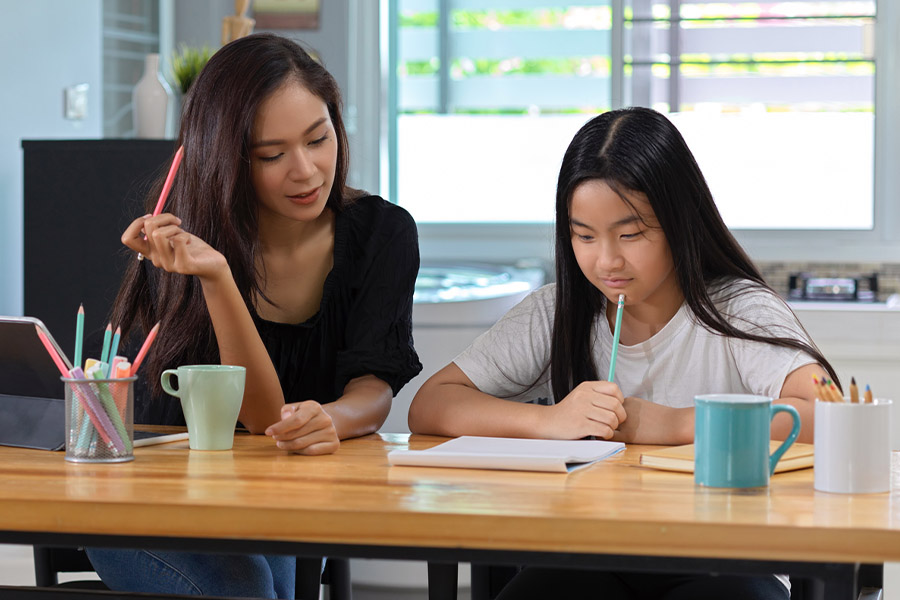 student and tutor together at a desk in Escondido